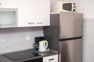 Kuchyň nebo kuchyňský kout v ubytování Apartments Miljenka