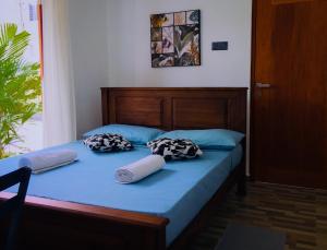 Un pat sau paturi într-o cameră la Tiamo Bed & Breakfast