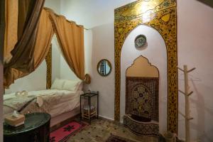 Postel nebo postele na pokoji v ubytování RIAD DAR DIWAN
