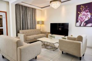 TV a/nebo společenská místnost v ubytování RESIDENCE NOUMSI