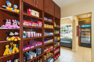 a store aisle with shelves filled with toys and snacks at Clementine Hotel & Suites Anaheim in Anaheim