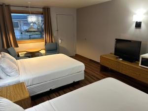Valley Inn and Suites tesisinde bir odada yatak veya yataklar