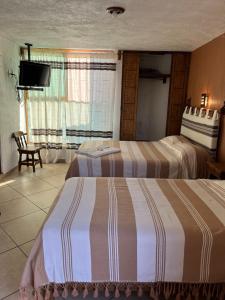 Postel nebo postele na pokoji v ubytování Posada Verona + 2 fotografie