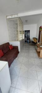a living room with a couch and a table at Quarto casal sossegado perto Pelourinho in Salvador