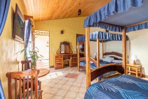 Postel nebo postele na pokoji v ubytování Hotel Claro de Luna