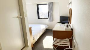 Postel nebo postele na pokoji v ubytování Smile Hotel Kitaasaka