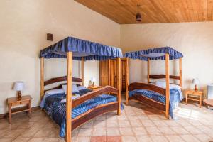 Postel nebo postele na pokoji v ubytování Hotel Claro de Luna