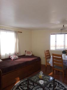 A bed or beds in a room at Mini Casa en Viña del Mar