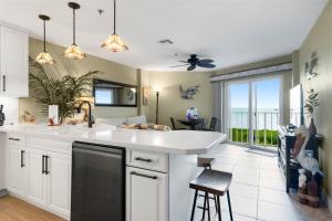 a kitchen with a sink and a large window at 4409 Ocean Pointe in Tavernier