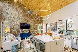 a kitchen and living room with a brick wall at Stars Over Austin in Austin