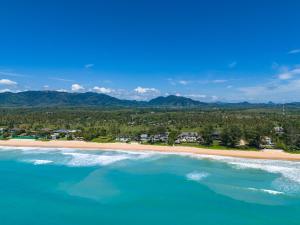 an aerial view of a beach with mountains in the background at Twin Villas Natai South - 5 Bedroom Luxury Beach Front Villa in Natai Beach