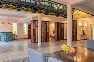 a lobby with a table with fruit on it at Ptas Songsaa by Amatak in Siem Reap