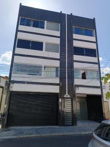 a tall building with a large garage door in front of it at RESIDENCIAL ESPERANÇA in Teresina