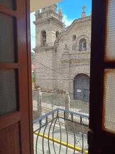 a view of a church from a window at HOSPEDAJE DONA in Ayacucho