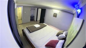 Postel nebo postele na pokoji v ubytování The Yafé Bastos 9 + 6 fotografií