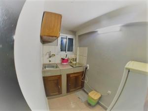 Kuchyň nebo kuchyňský kout v ubytování The Yafé Bastos 10