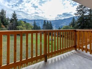 a wooden balcony with a view of a mountain at Appartement Méribel, 2 pièces, 4 personnes - FR-1-180-588 in Les Allues