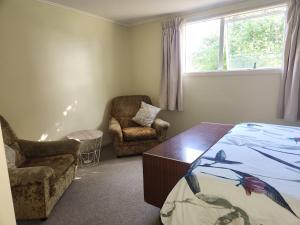 Postel nebo postele na pokoji v ubytování Quirky Villa Homestay