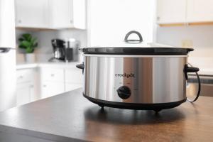 a slow cooker sitting on a counter in a kitchen at Downtown home! Walk to Bulls Stadium, DPAC & food in Durham