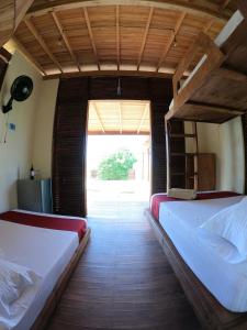 Postel nebo postele na pokoji v ubytování Ecorali Lodge