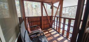 a room with a rocking chair in a cabin at snowhere ski lodge in Hakuba