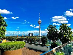 a view of the space needle tower from a rooftop at Platinum Suites KLCC Kuala Lumpur Bukit Bintang by AR Hospitality in Kuala Lumpur