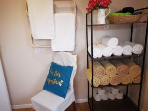 a towel rack with towels and towels at Nice house on Wesley Auckland in Auckland
