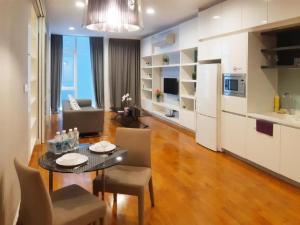 a living room with a dining table and a kitchen at Platinum Suites KLCC Kuala Lumpur Bukit Bintang by AR Hospitality in Kuala Lumpur
