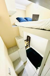 a small room with a bed and a laptop on it at Dubai Creek in Dubai