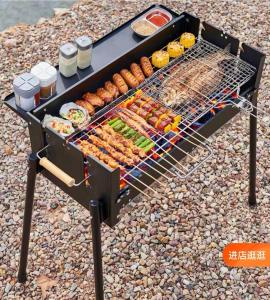 a barbecue grill with vegetables and other food on it at 埔里北梅民宿BEI MEI Homestay可包棟 in Puli