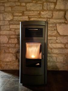 a fire inside of an oven in a brick wall at Les Lavandes de Durbuy in Durbuy