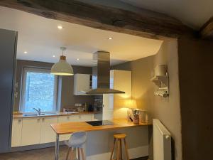 a kitchen with a wooden counter top in a room at Les Lavandes de Durbuy in Durbuy