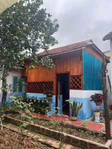 a house with a blue and white exterior at 84 April Real Home in Plei Groi