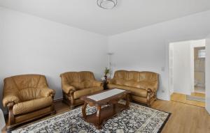 a living room with two couches and a coffee table at Lovely Apartment In Jena With Wifi in Jena
