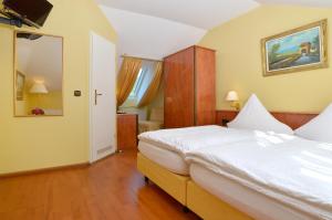 Postel nebo postele na pokoji v ubytování Hotel Zehnthof