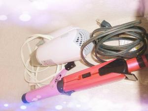 a hairdryer and a hair dryer with a cord at 稲荷 かおり in Kyoto
