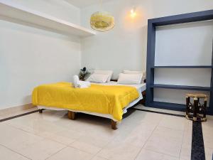 Postel nebo postele na pokoji v ubytování Varkala Villa