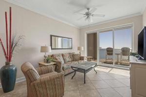 a living room with a couch and a table at Island Royale P102 in Gulf Shores