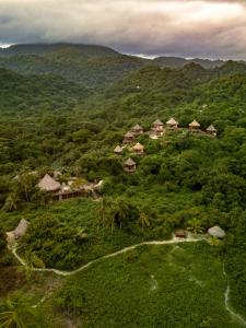 an aerial view of a resort in the mountains at Ecohabs Tequendama Playa Cañaveral Parque Tayrona in El Zaino