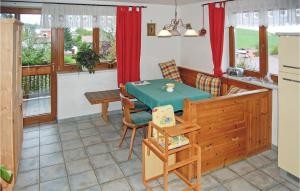 a kitchen with a table and a dining room at Hanselerhof in Rinn