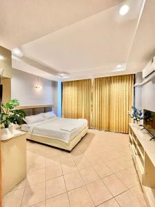 Ένα ή περισσότερα κρεβάτια σε δωμάτιο στο Nona Pattaya Hotel +10 φωτογραφίες