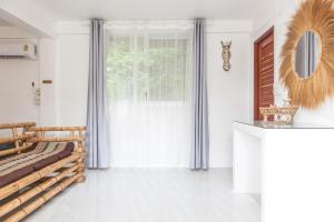 Postel nebo postele na pokoji v ubytování Archie Village