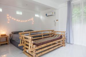 Postel nebo postele na pokoji v ubytování Archie Village + 37 fotografií