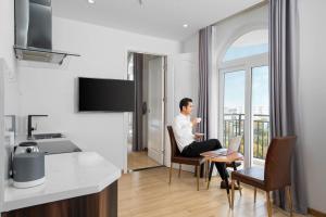 TV a/nebo společenská místnost v ubytování RHM Luxury Hotel And Suite