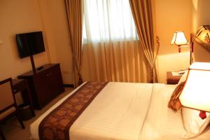Postel nebo postele na pokoji v ubytování Debredamo Hotel