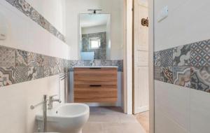 a bathroom with a sink and a mirror at La Casetta Al Mar in Porto Cesareo +38 photos