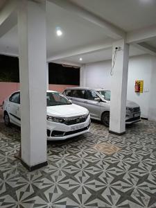 a garage with three cars parked in it at SM Residency in Coimbatore