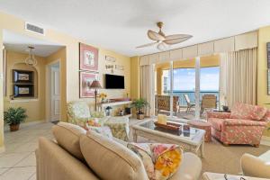 a living room with a couch and a table at Beach Colony East 7C in Perdido Key