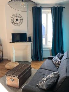 Et opholdsområde på Studio Cosy à 12 min à pieds de la Gare