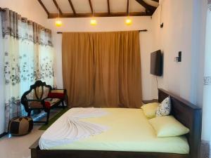 Postel nebo postele na pokoji v ubytování Center Point Villa Unawatuna